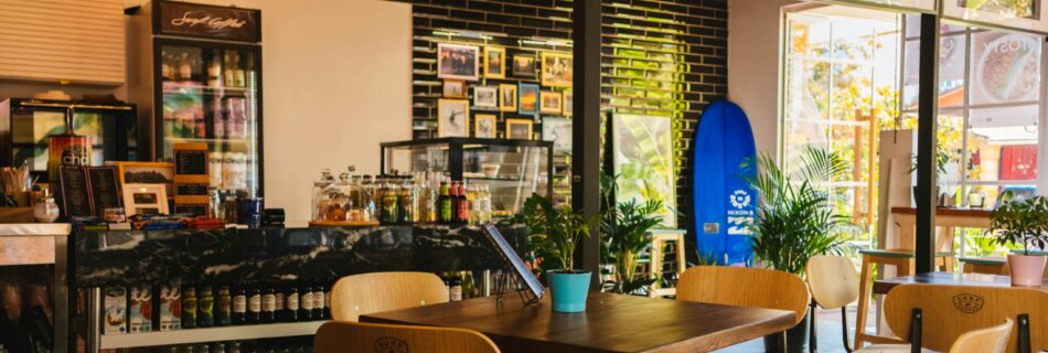 Stylish café interior with modern decor and natural lighting, located in Sochi, Russia.